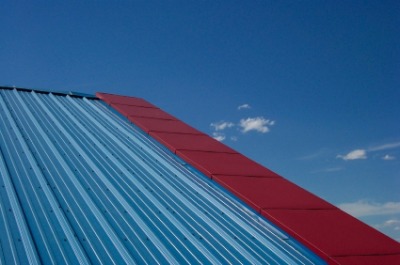 Blue and red metal roofing. Photo by wolv on iStockphoto.