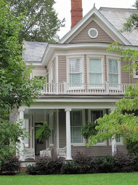 Wood siding does not have to look like a wood cabin. Shown here is the Hardy House. Photo by Universal Pops on Flickr.