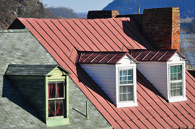 Metal roofing vs composite roofing: Both materials have their pros and cons, with the weight of each varying by a homeowner's specific roofing needs.