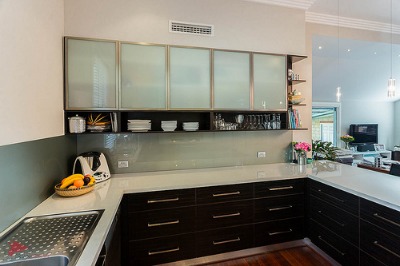 Avoid having space above your cabinets since it only requires more cleaning. Photo by Bryan Lee - Bryan Design & Photography on Flickr.