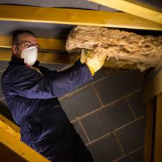 installing-insulation-attic